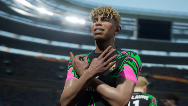 A screenshot from eFootball™ showing a football player celebrating a goal with crossed arms in a stadium.