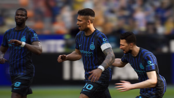 A screenshot from eFootball™ showing three players in blue and black jerseys celebrating during a match.