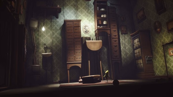 Screenshot from Little Nightmares showing a dimly lit room with a small figure in a yellow raincoat surrounded by tall furniture.