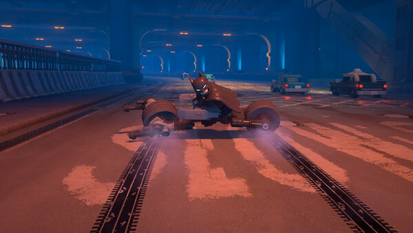A screenshot from LEGO® Batman™: Legacy of the Dark Knight showing Batman on a Batcycle in a dimly lit underground tunnel.