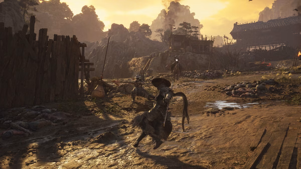 Screenshot from Phantom Blade Zero showing a warrior with a sword advancing in a rustic village landscape at sunset.