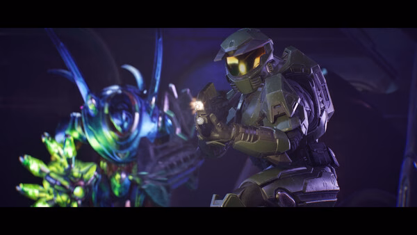 Halo: Campaign Evolved screenshot: A futuristic soldier in armor aims a weapon while an alien creature stands nearby.