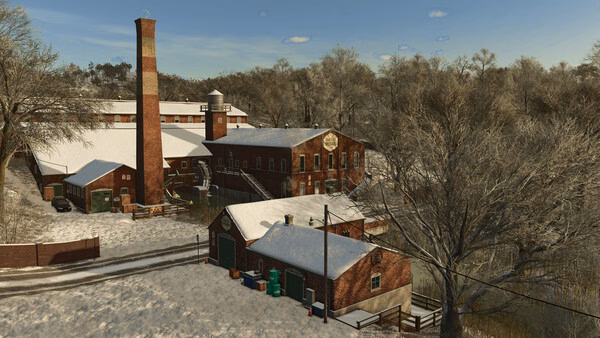 Screenshot from Farming Simulator 25 showing a snow-covered farm with brick buildings and bare trees in a winter landscape.