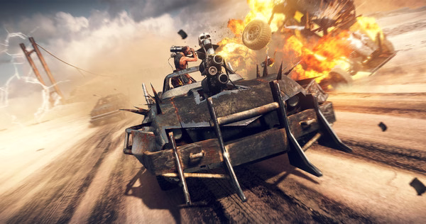 Screenshot from Mad Max showing a spiked vehicle with mounted guns racing through a desert as an explosion occurs nearby.