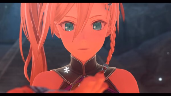 Screenshot from Ys X: Proud Nordics showing a close-up of a character with red hair and bright eyes, facing forward.