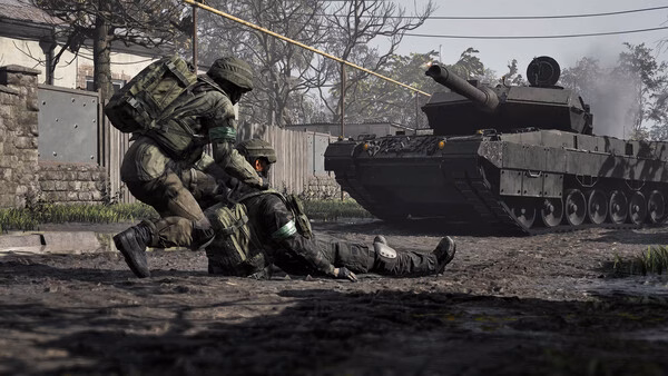 Two soldiers in combat gear assist an injured comrade near a tank in a WARDOGS game screenshot showing a war-torn environment.